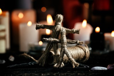 Photo of Voodoo dolls on table in dark room. Curse ceremony