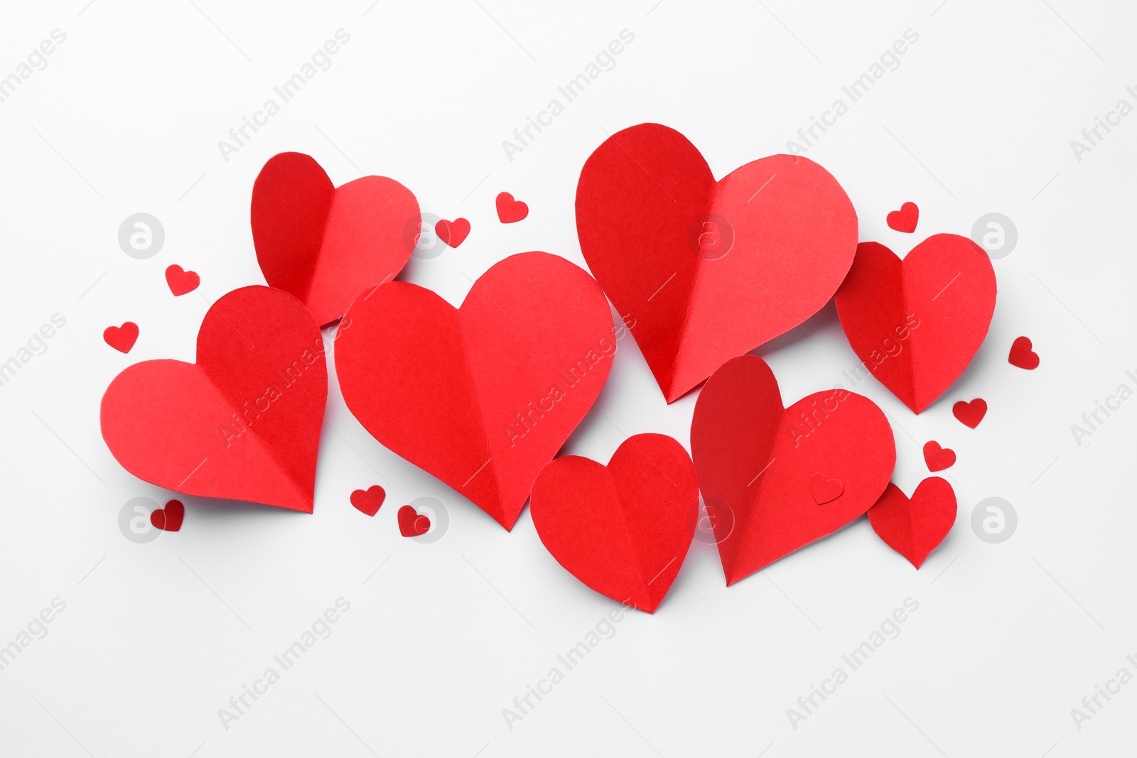 Photo of Paper hearts on white background, flat lay