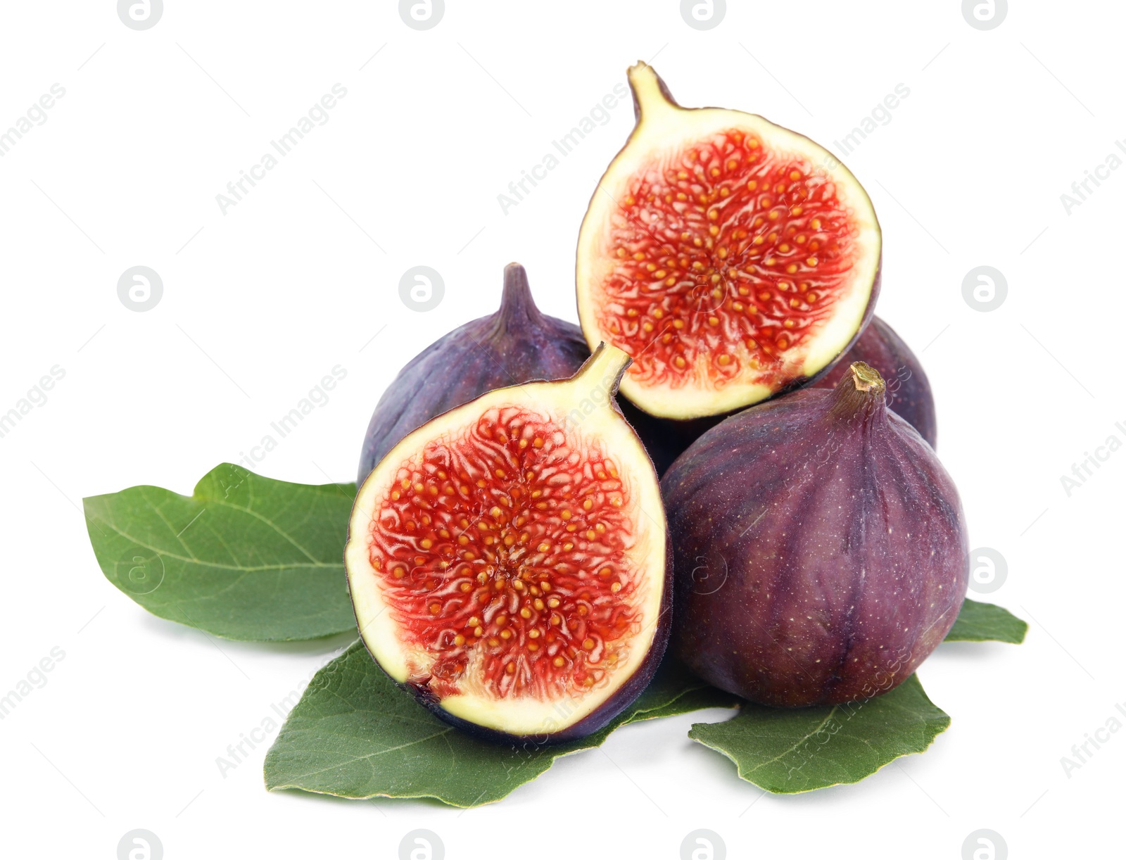 Photo of Fresh juicy purple figs and green leaves on white background