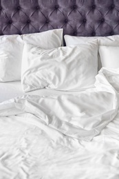 Photo of Comfortable bed with white linen at home