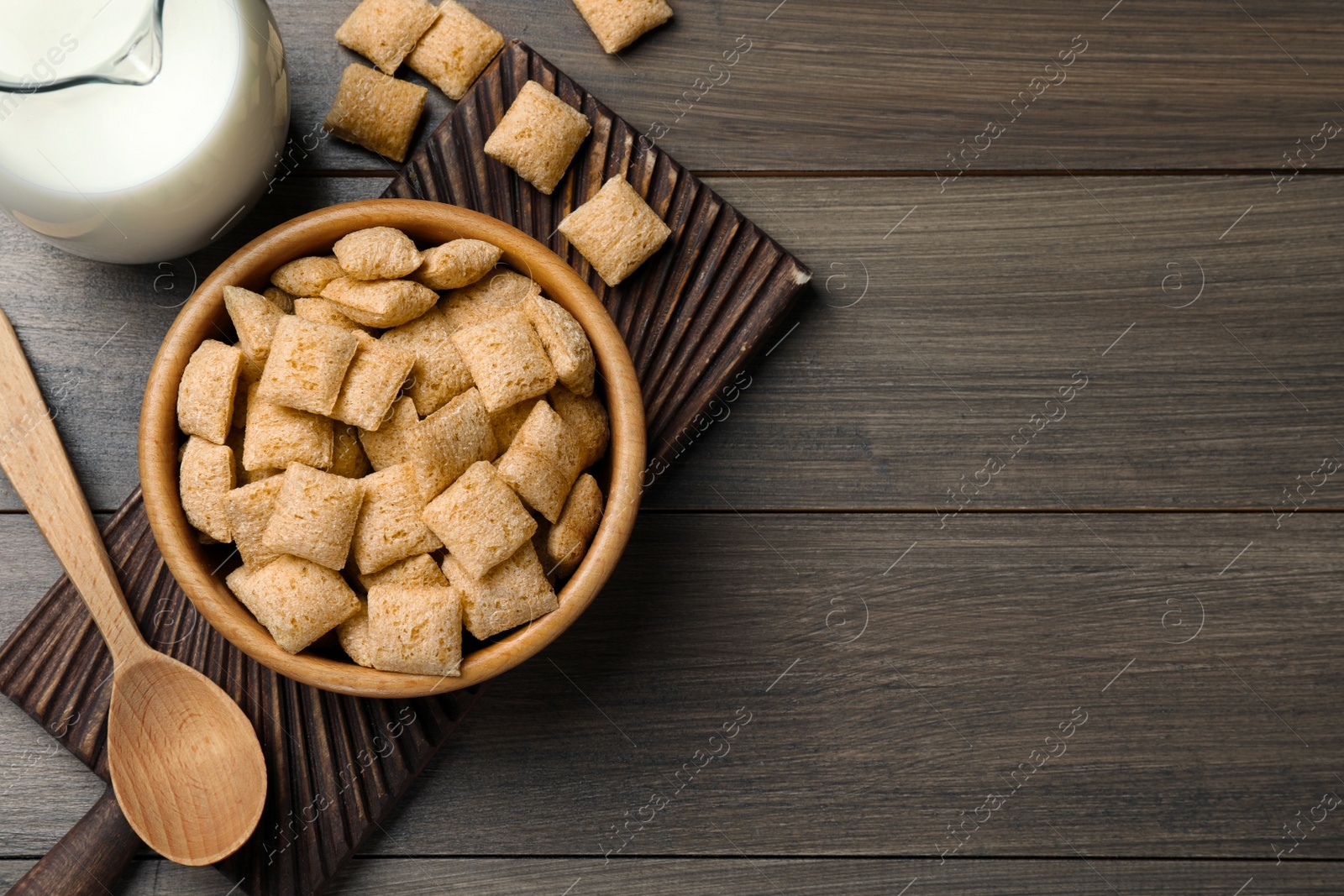 Photo of Delicious corn pads served on wooden table, flat lay. Space for text