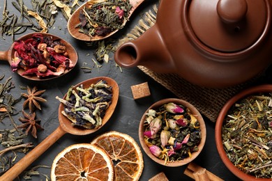 Flat lay composition with different dry teas on grey table