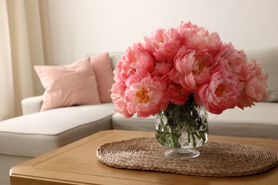 Photo of Beautiful pink peonies in vase on table at home, space for text. Interior design