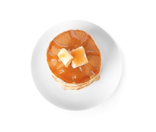 Stack of tasty pancakes with butter and maple syrup on white background, top view