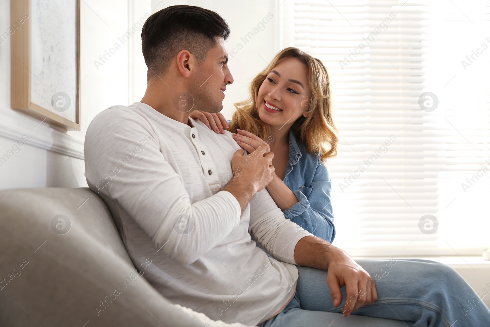 Photo of Lovely couple enjoying time together at home