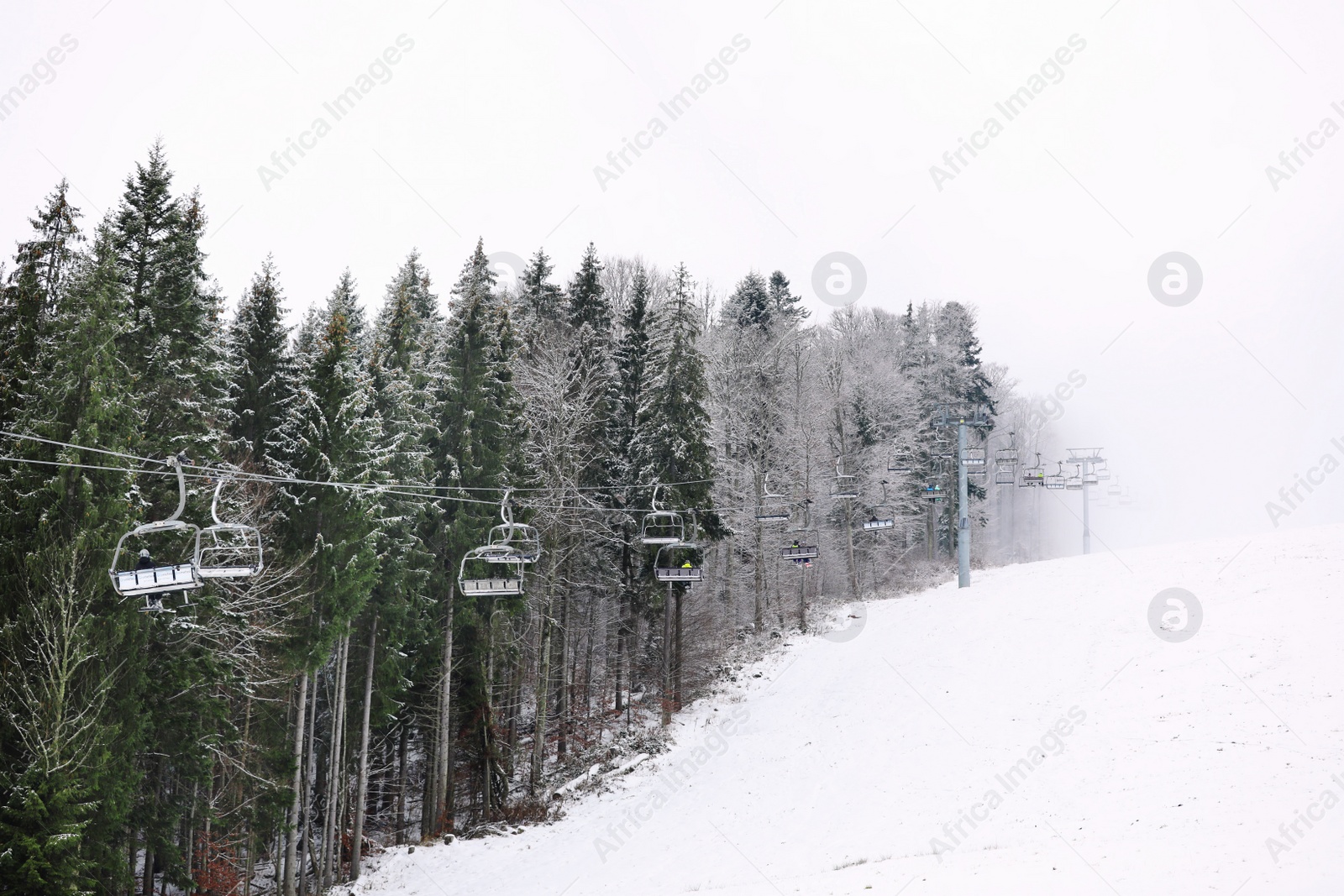 Photo of Beautiful landscape with ski lift at mountain resort. Winter vacation