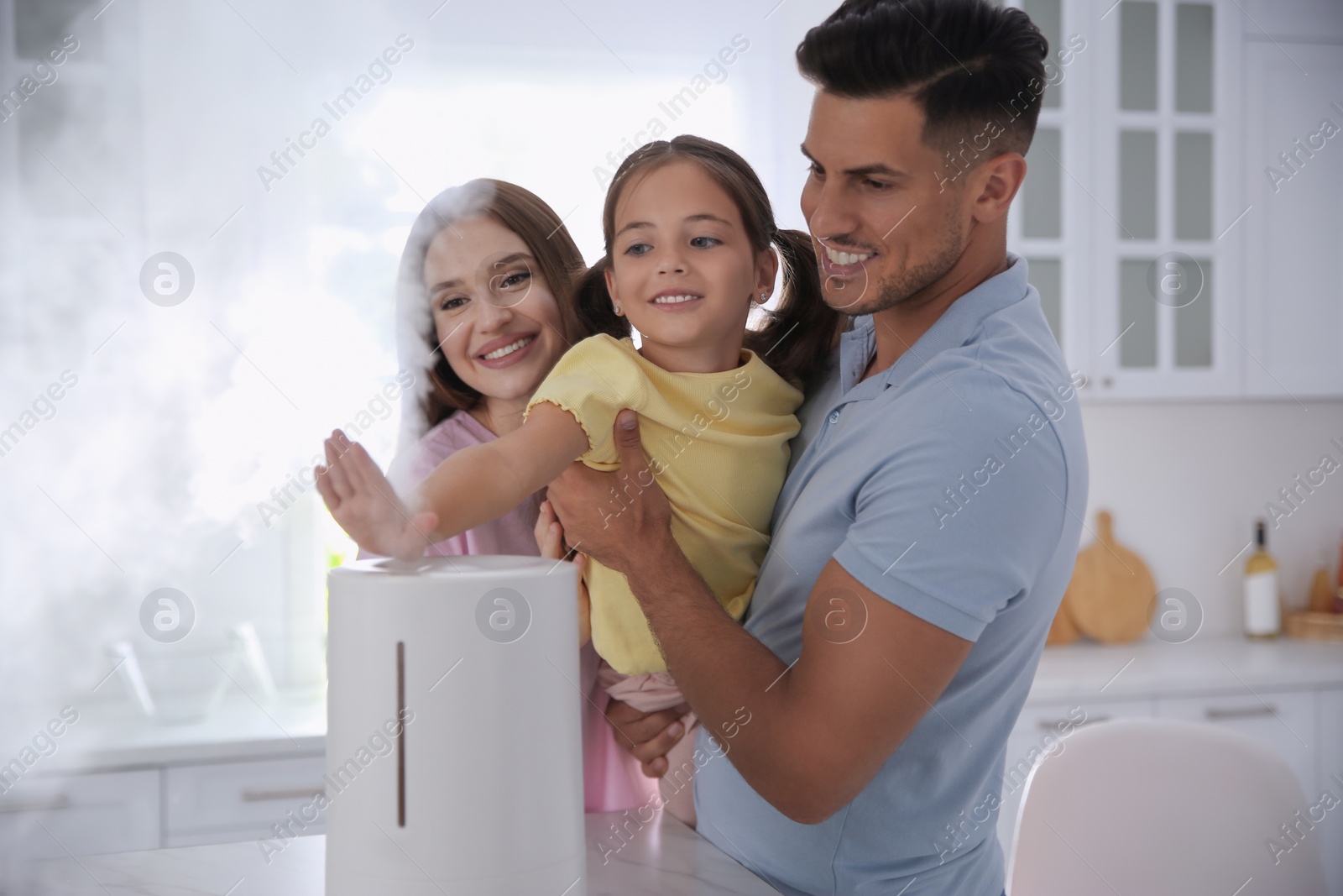 Photo of Family in kitchen with modern air humidifier