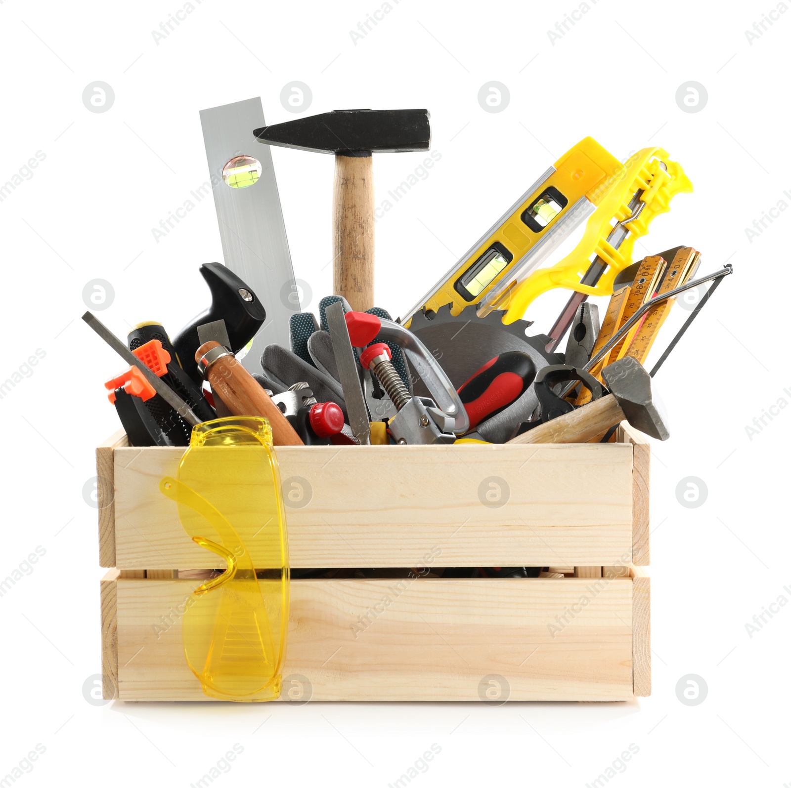 Photo of Wooden crate with different carpenter's tools isolated on white