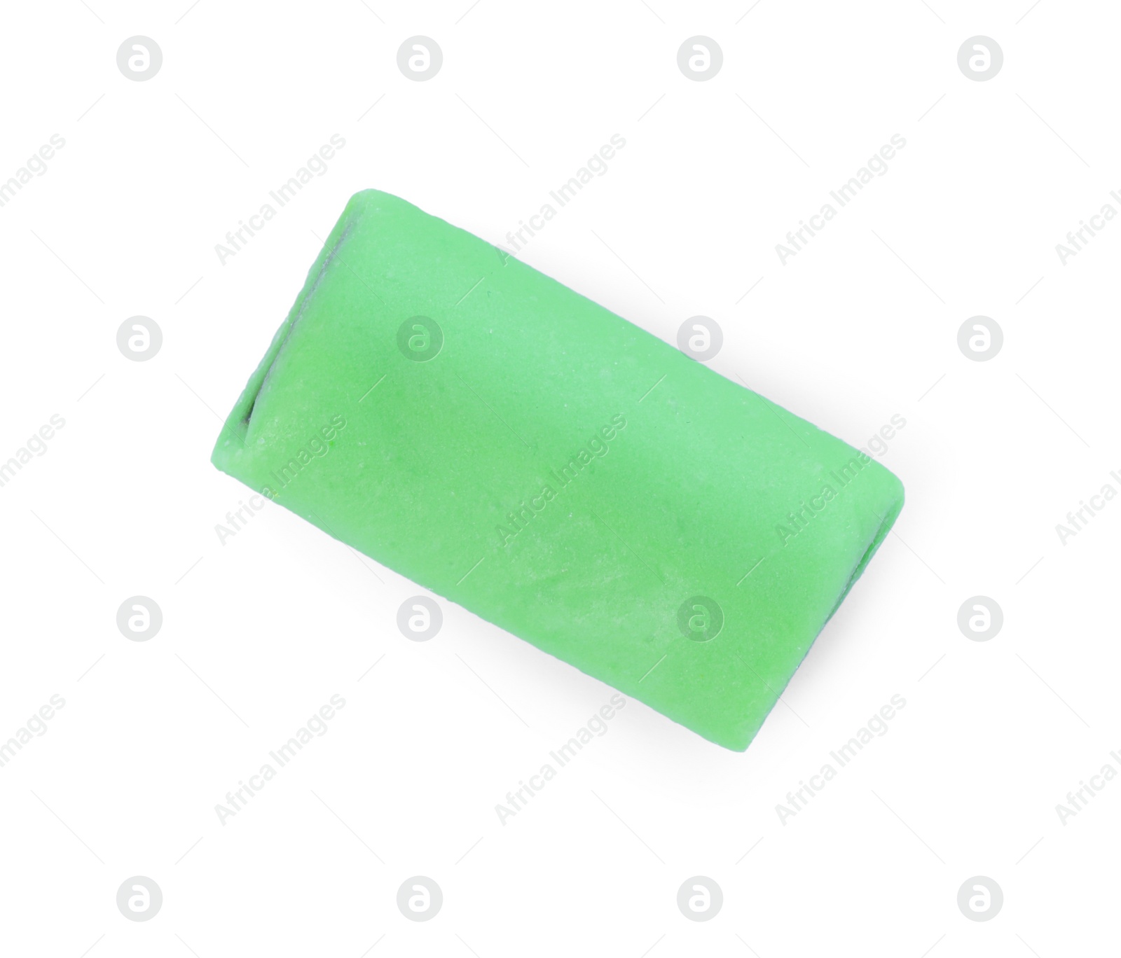 Photo of Green chewy candy with liquorice isolated on white, top view