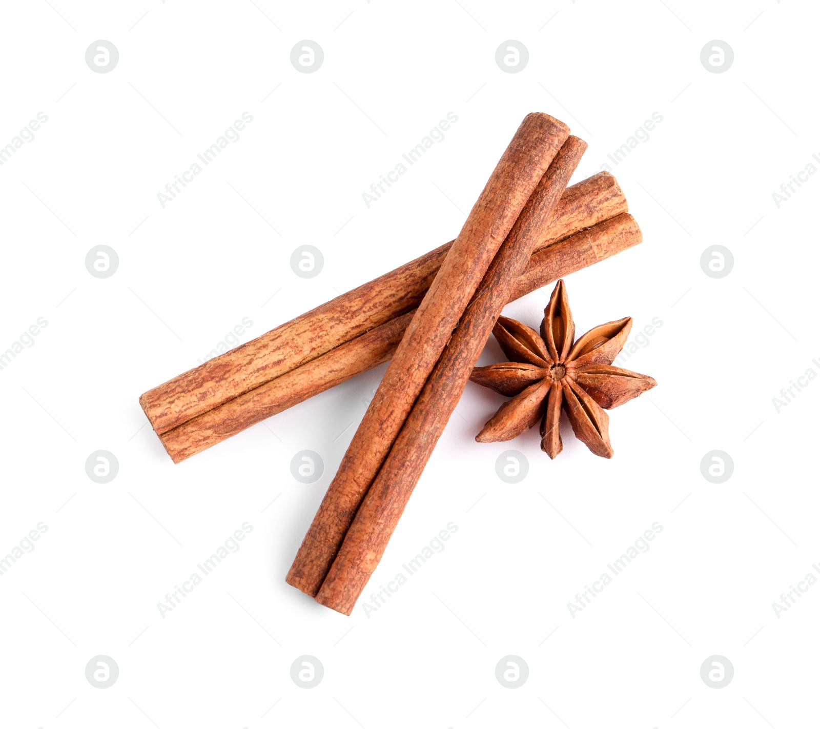 Photo of Cinnamon sticks and anise star isolated on white, top view