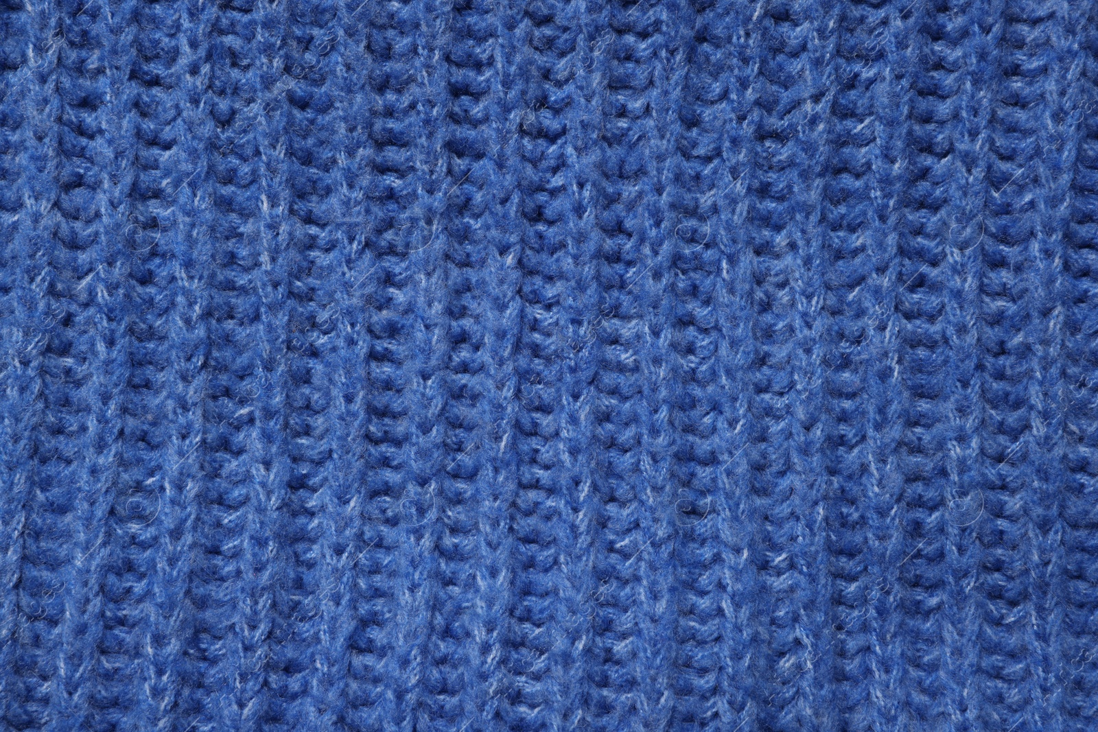 Photo of Texture of soft blue fabric as background, top view