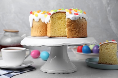 Photo of Beautiful Easter cakes on light grey marble table