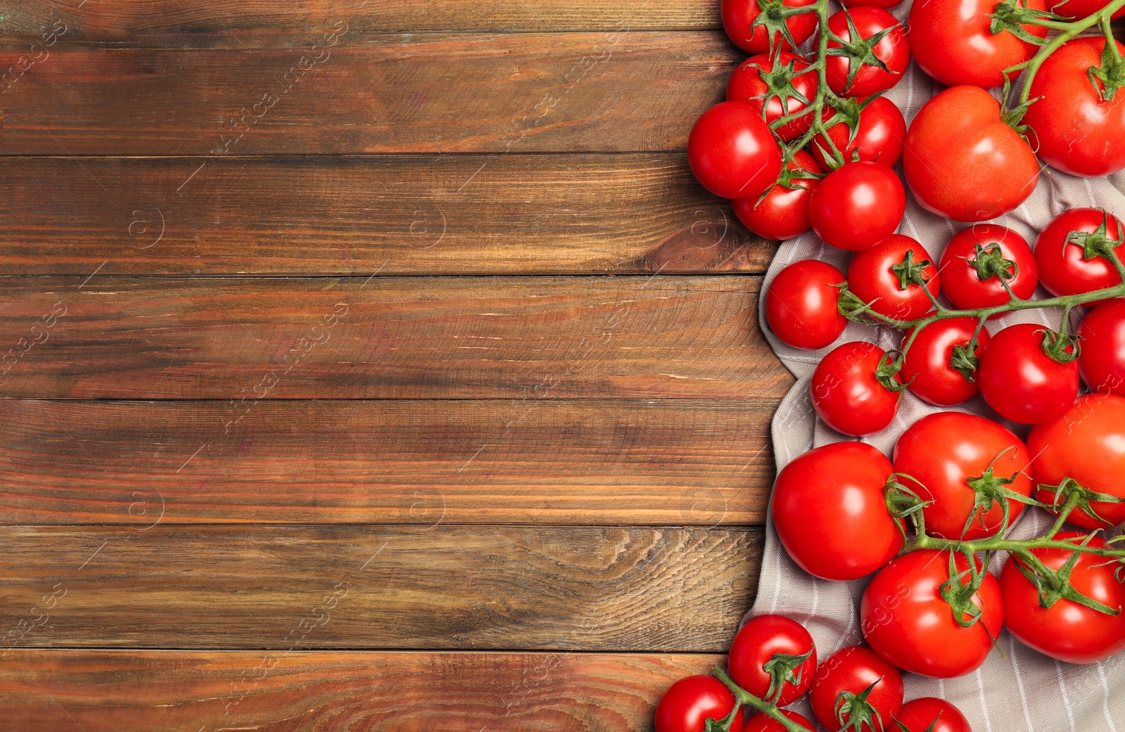 Photo of Flat lay composition with ripe tomatoes on wooden background