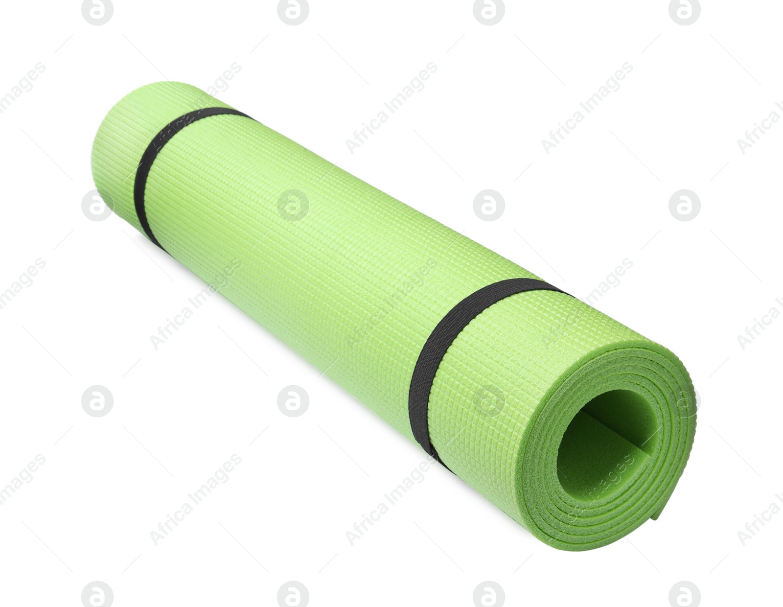 Photo of Rolled light green camping mat isolated on white