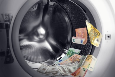 Image of Money laundering. Many euro banknotes in washing machine