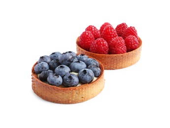 Photo of Tartlets with different fresh berries isolated on white. Delicious dessert