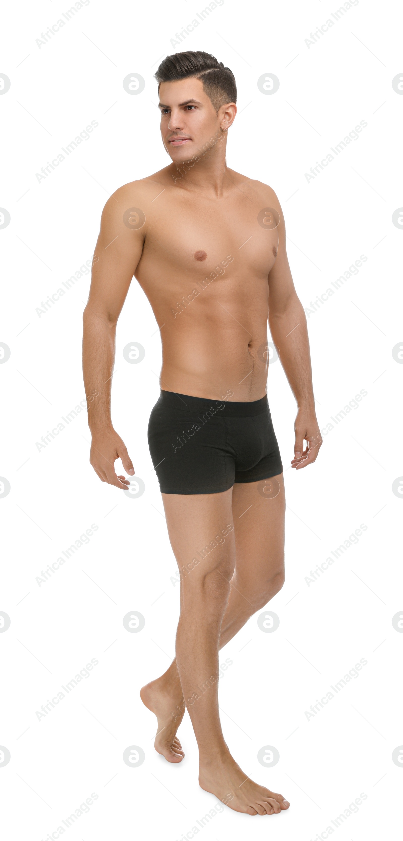 Photo of Handsome man in black underwear on white background