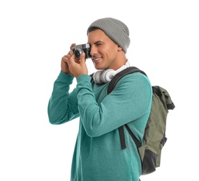 Photo of Man with backpack taking picture on white background. Autumn travel