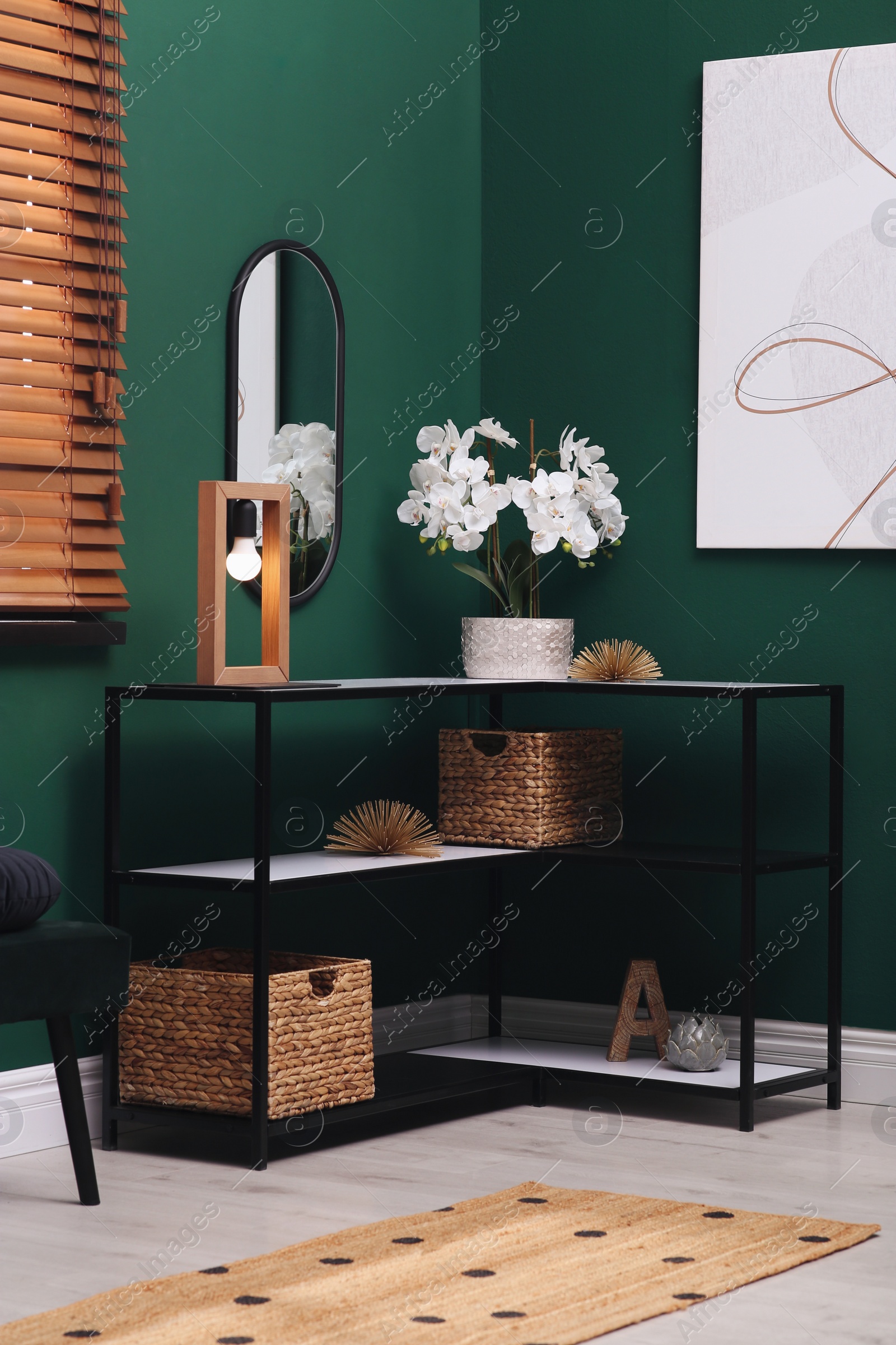 Photo of Modern hallway interior with console table and beautiful orchid flower