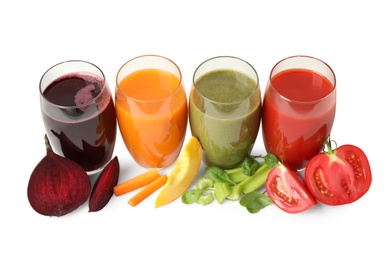 Photo of Delicious vegetable juices and fresh ingredients on white wooden table