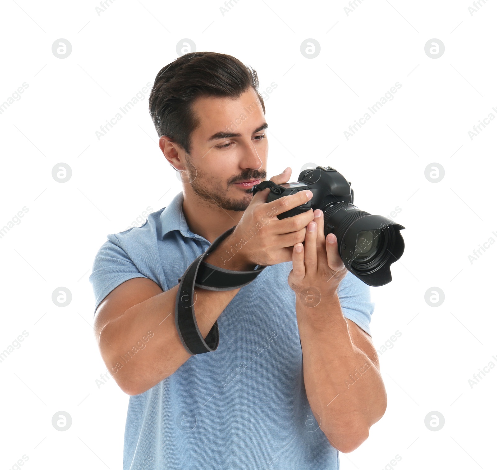 Photo of Young photographer with professional camera on white background