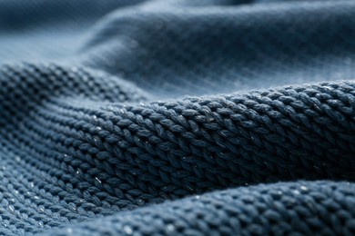 Photo of Beautiful pale blue knitted fabric as background, closeup