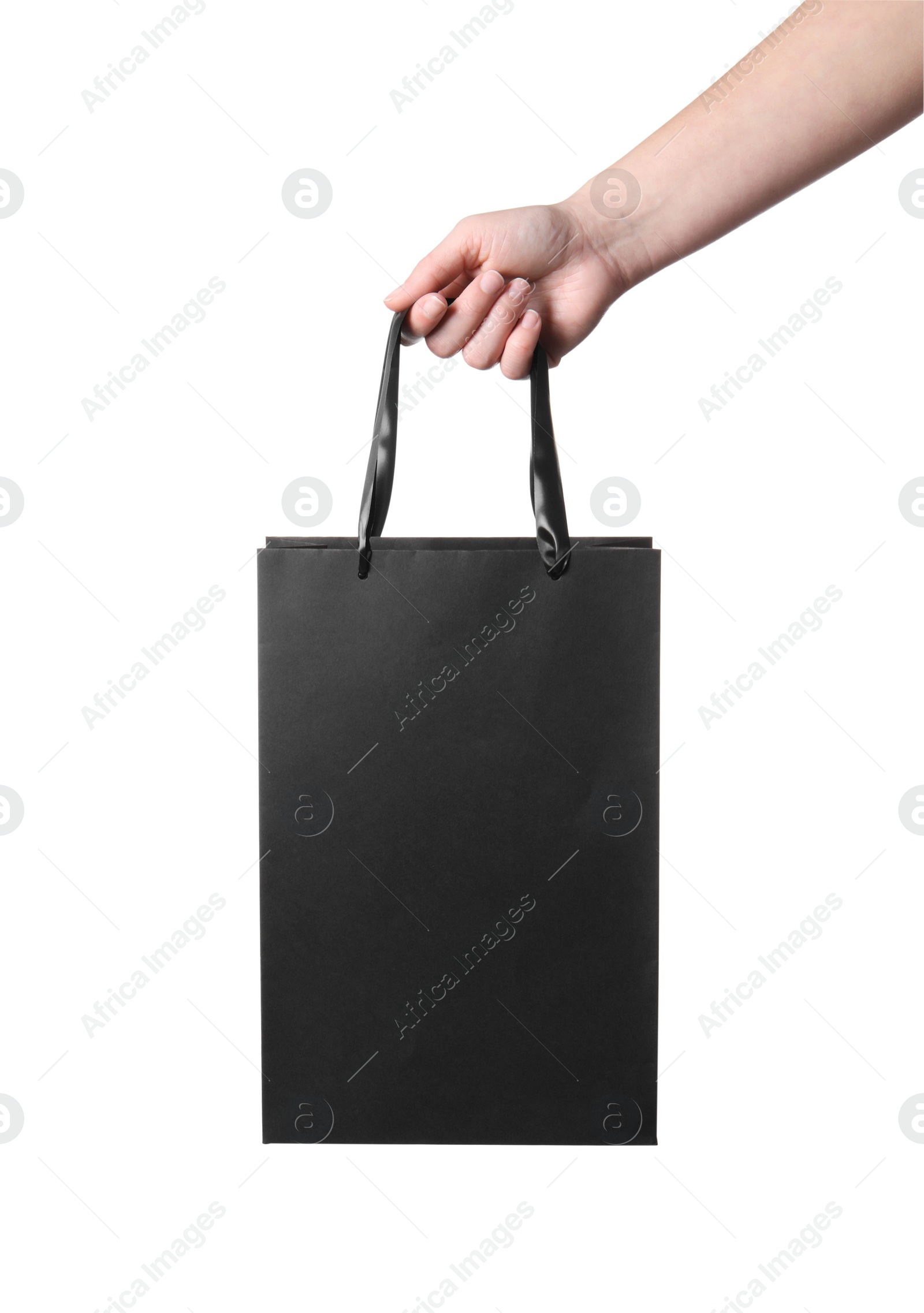 Photo of Woman holding paper shopping bag on white background, closeup