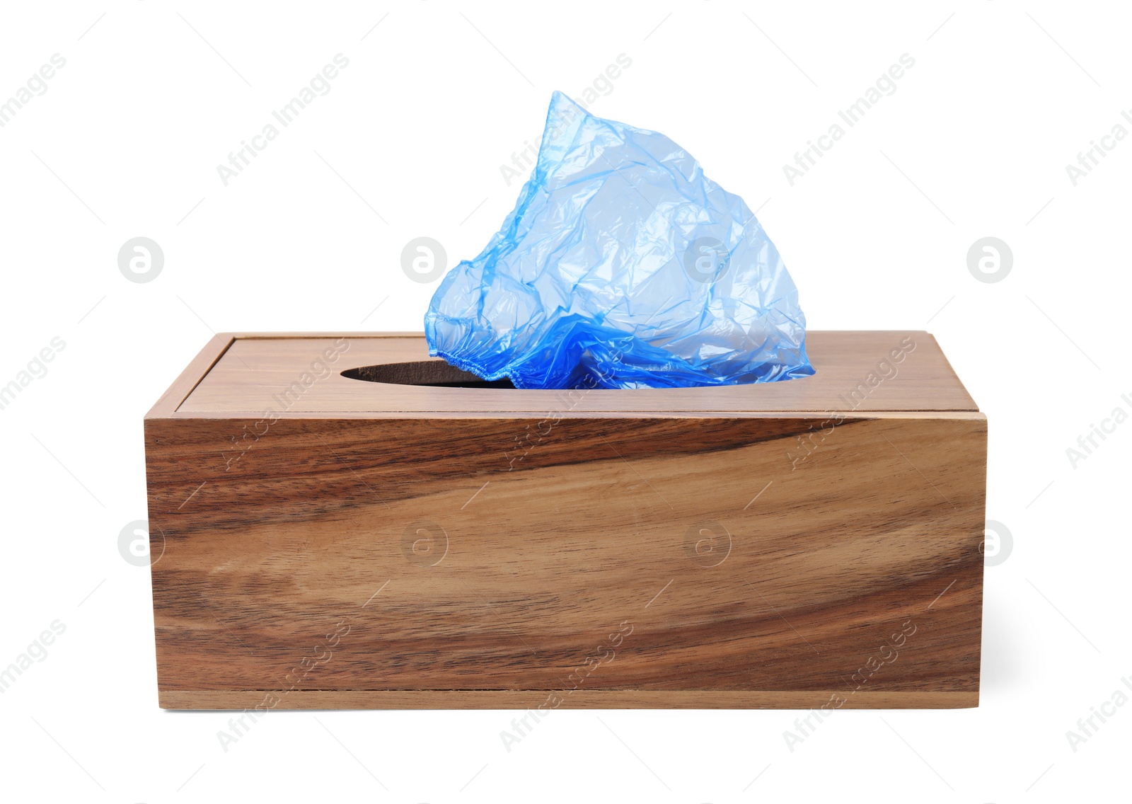 Photo of Blue medical shoe covers in wooden box isolated on white