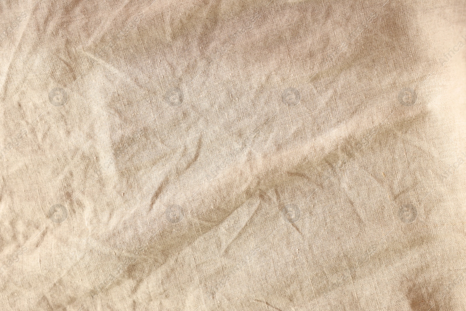 Photo of Beautiful beige fabric as background, top view