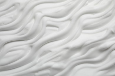 Photo of Texture of white shaving foam as background, top view