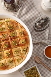 Photo of Delicious sweet baklava served on table, flat lay