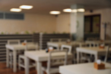 Photo of Blurred view of modern school canteen with new furniture