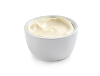 Delicious mayonnaise sauce in bowl on white background