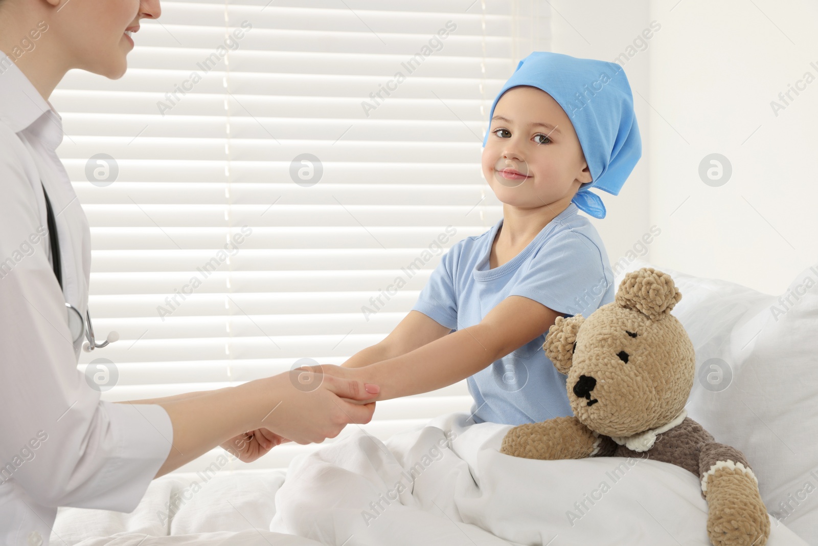 Photo of Childhood cancer. Doctor and little patient in hospital