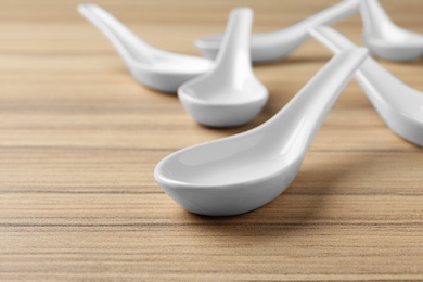 Photo of Clean Miso soup spoons on wooden table