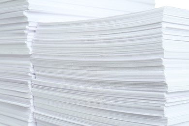 Photo of Stacks of white paper sheets, closeup view