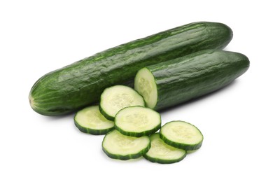 Photo of Whole and cut long cucumbers isolated on white