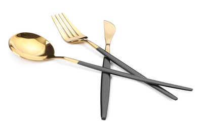 Shiny golden fork, knife and spoon isolated on white. Luxury cutlery set