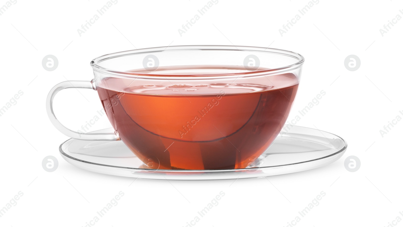 Photo of Glass cup of tea and saucer isolated on white