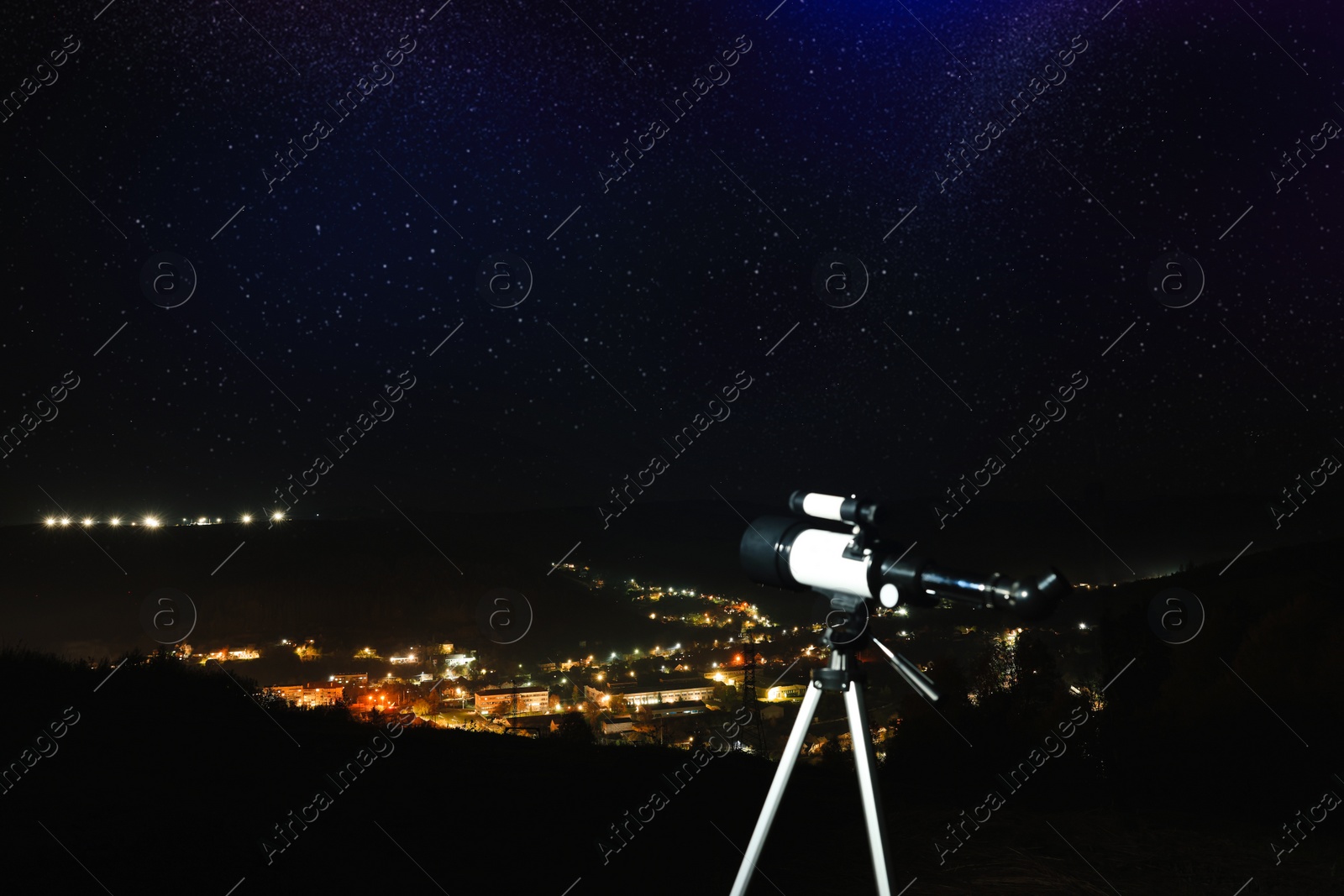 Photo of Picturesque view of city and modern telescope in night outdoors. Learning astronomy