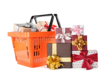 Orange shopping basket with different gifts on white background