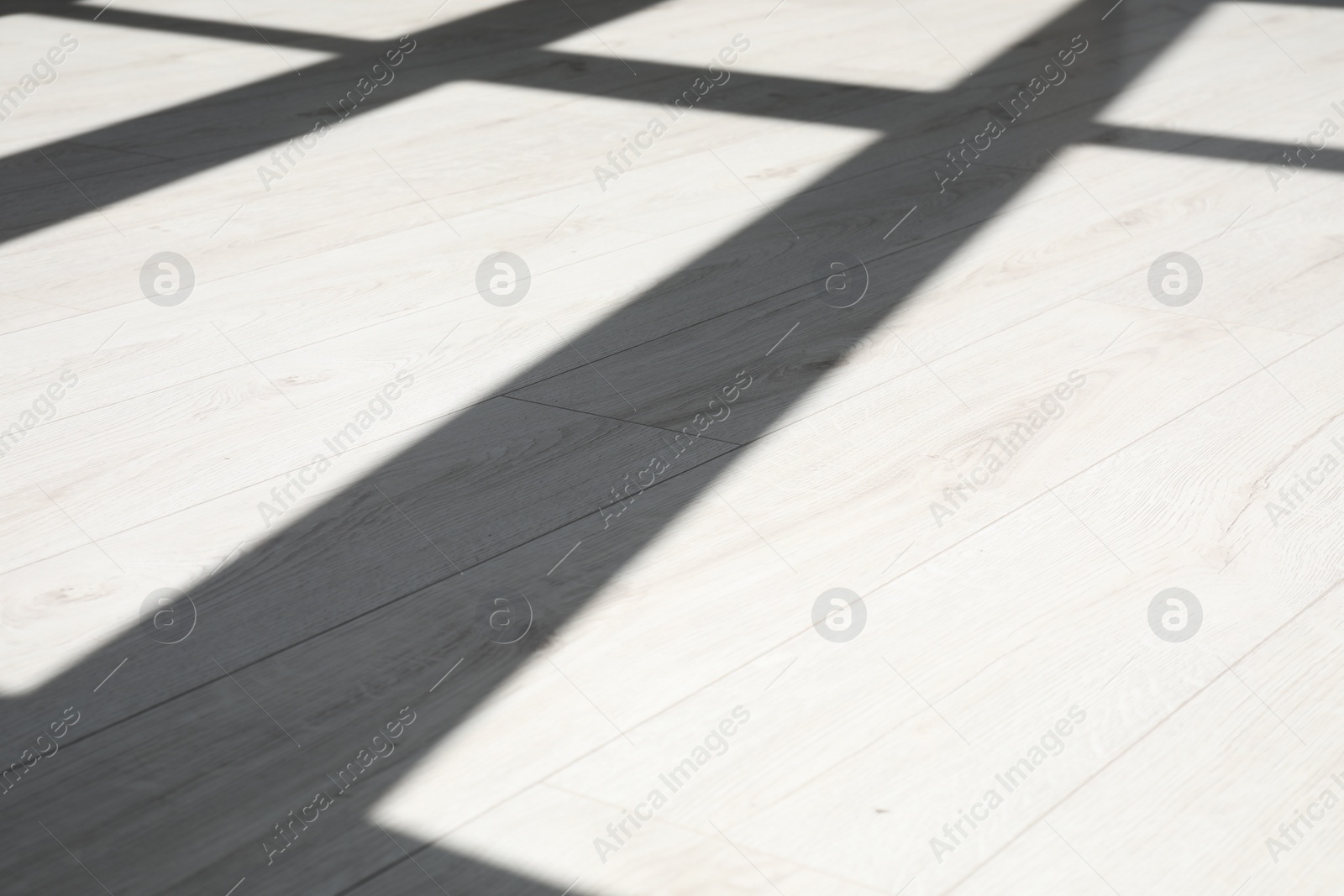 Photo of Shadow from window on white laminated floor indoors