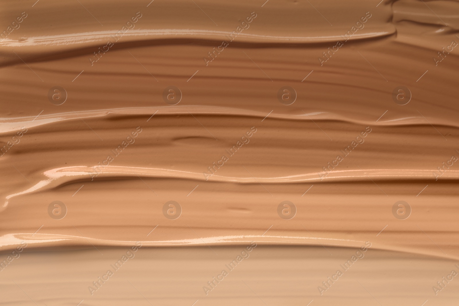 Image of Different shades of liquid foundation as background, closeup