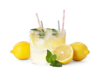 Photo of Natural lemonade with mint and fresh fruits on white background. Summer refreshing drink