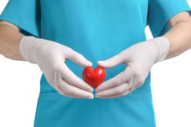 Photo of Doctor in medical gloves holding red heart on white background, closeup