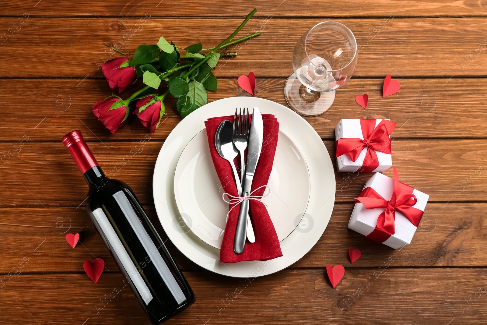 Photo of Beautiful table setting for Valentine's Day dinner on wooden background, flat lay