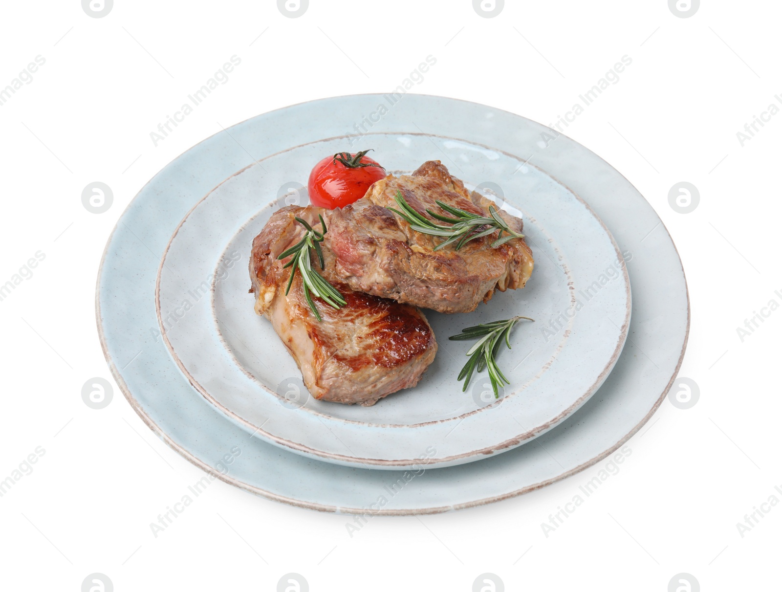 Photo of Plate of delicious fried meat with rosemary and tomato isolated on white