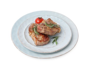 Photo of Plate of delicious fried meat with rosemary and tomato isolated on white