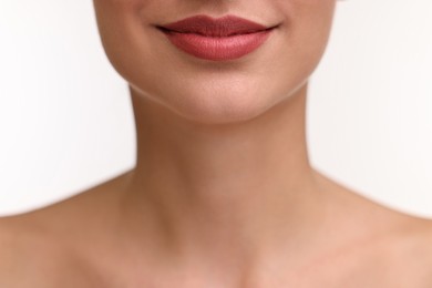 Photo of Woman with beautiful lips on white background, closeup