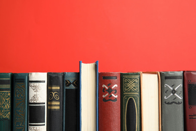 Collection of old books on red background